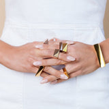 The initial design that the flex collection was built from, the Flex Double Finger Ring is a new must-have statement piece for any jewelry collection. Featuring a unique double-finger design, this attractive piece of jewelry is perfect for any style. The ring is made with high quality brass and 14K gold plated for durable wear. Add some flair and edge to any outfit with the Flex Double Finger Ring. Pair with the Flex Necklace to complete the look. 
