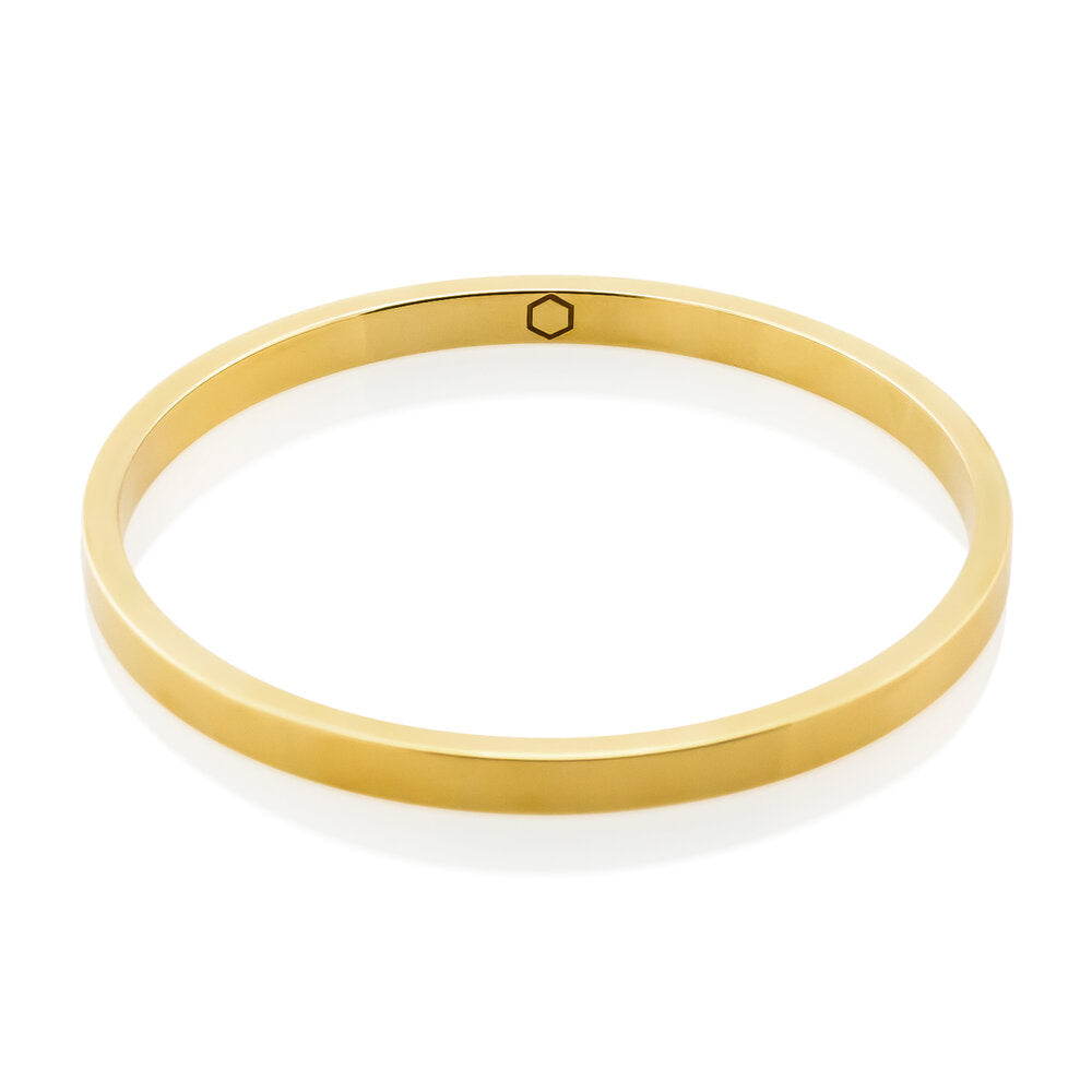 Cyclical Bangle: Crafted from sterling silver with 14K gold vermeil, this bangle from our Cyclical Collection is an elegant and timeless piece of jewelry. Crafted from sterling silver with 14K gold vermeil, this bangle from our Cyclical Collection is an elegant and timeless piece of jewelry. Wear it alone or pair it with our Cyclical Thick or Thin Ring for a luxurious, coordinated look. Perfect for any occasion, it is a great addition to your jewelry collection.