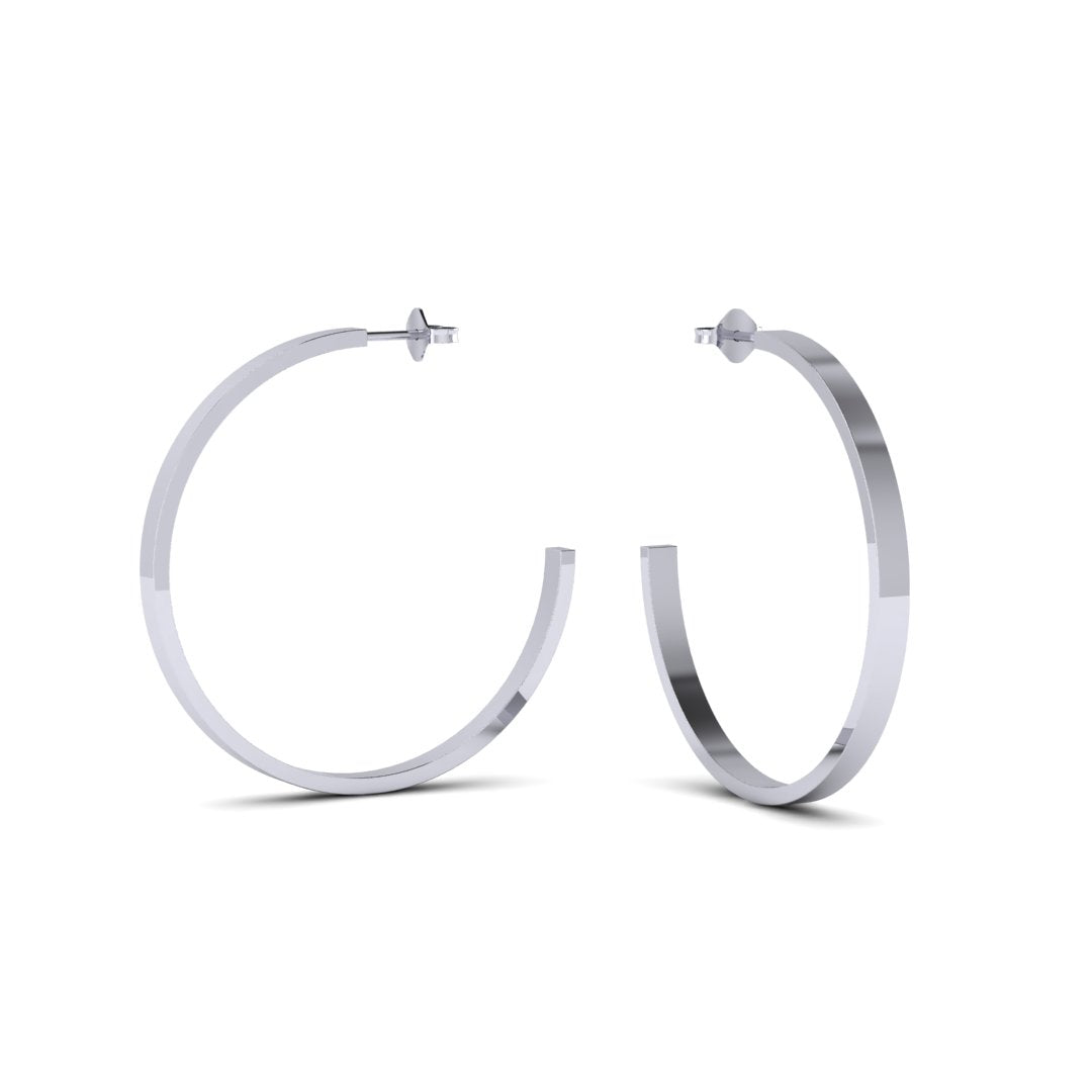 Modernize your look with these classic medium hoop earrings. Crafted from sterling silver, these timeless hoops are sure to become your go-to for any occasion. Sleek, lightweight, and durable, you're sure to adore these for years to come. These are the perfect piece for curating the ear. Wear with the Small Hoops or Huggie Hoops to complete the look. 