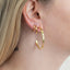  Crafted with beautiful lab-grown diamonds, these earrings add a touch of sophistication to any outfit. Get the luxurious sparkle of diamonds without the ethical and environmental concerns that come with mined diamonds. It is the perfect pair for curating the ear. Wear with the small hoops and huggie hoops to complete the look. 